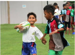 A blind boy holding the hand of anotgher boy and running together