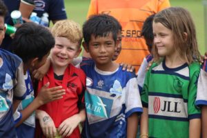 Cambodian and foreigner boys and girls together congratulating each others